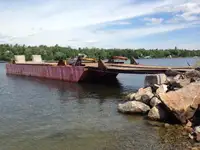 1990 60’ x 16’ x 6’ Steel Deck Barge with Ramps, Spud wells and Spuds